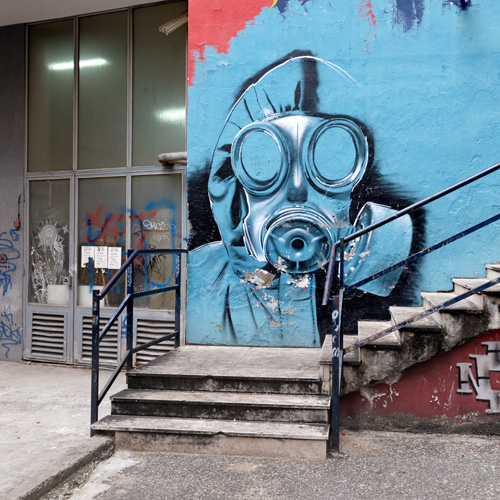 Colourful graffiti of masked figure in Rijeka, Croatia